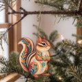 Laser-cut maple wood Eastern Chipmunk folk art ornament O287 hanging on a fir branch, made in USA