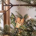 Laser-cut maple wood Pallid Bat folk art ornament O291 hanging on a fir branch, made in USA