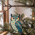 Laser-cut maple wood Great Horned Owl folk art ornament O297 hanging on a fir branch, made in USA