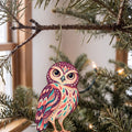 Laser-cut maple wood Burrowing Owl folk art ornament O300 hanging on a fir branch, made in USA
