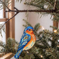 Laser-cut maple wood Western Bluebird folk art ornament O306 hanging on a fir branch, made in USA