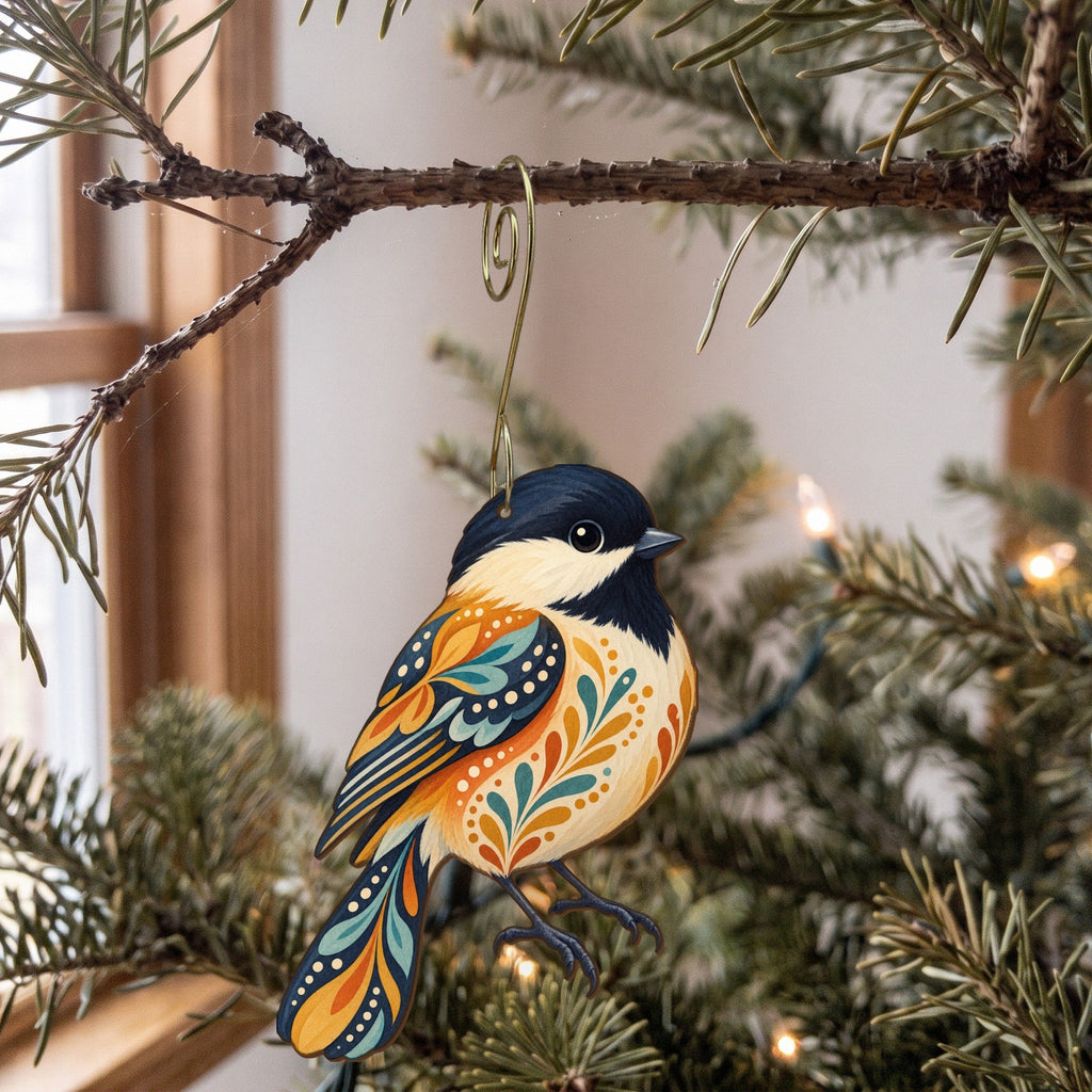 Laser-cut maple wood Black-Capped Chickadee folk art ornament O314 hanging on a fir branch, made in USA