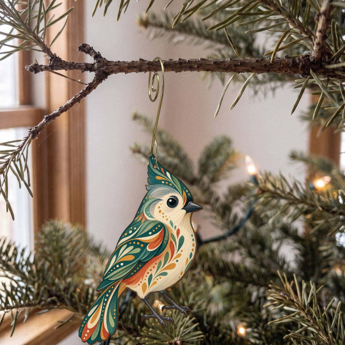 Laser-cut maple wood Tufted Titmouse folk art ornament O315 hanging on a fir branch, made in USA