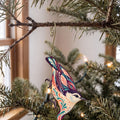 Laser-cut maple wood White-Breasted Nuthatch folk art ornament O316 hanging on a fir branch, made in USA