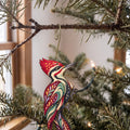Laser-cut maple wood Pileated Woodpecker folk art ornament O318 hanging on a fir branch, made in USA