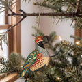 Laser-cut maple wood Gambel's Quail folk art ornament O323 hanging on a fir branch, made in USA