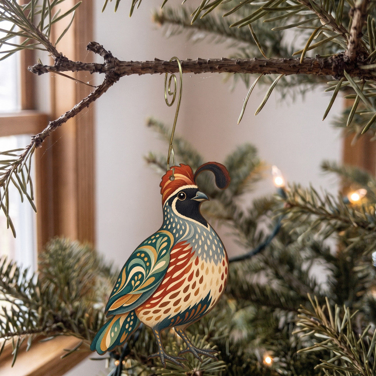 Laser-cut maple wood Gambel's Quail folk art ornament O323 hanging on a fir branch, made in USA