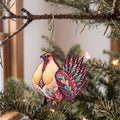 Laser-cut maple wood Greater Sage-Grouse folk art ornament O324 hanging on a fir branch, made in USA