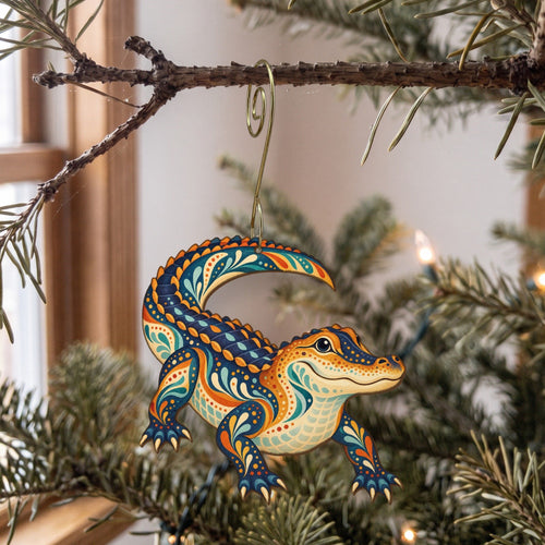 Laser-cut maple wood American Alligator folk art ornament O330 hanging on a fir branch, made in USA