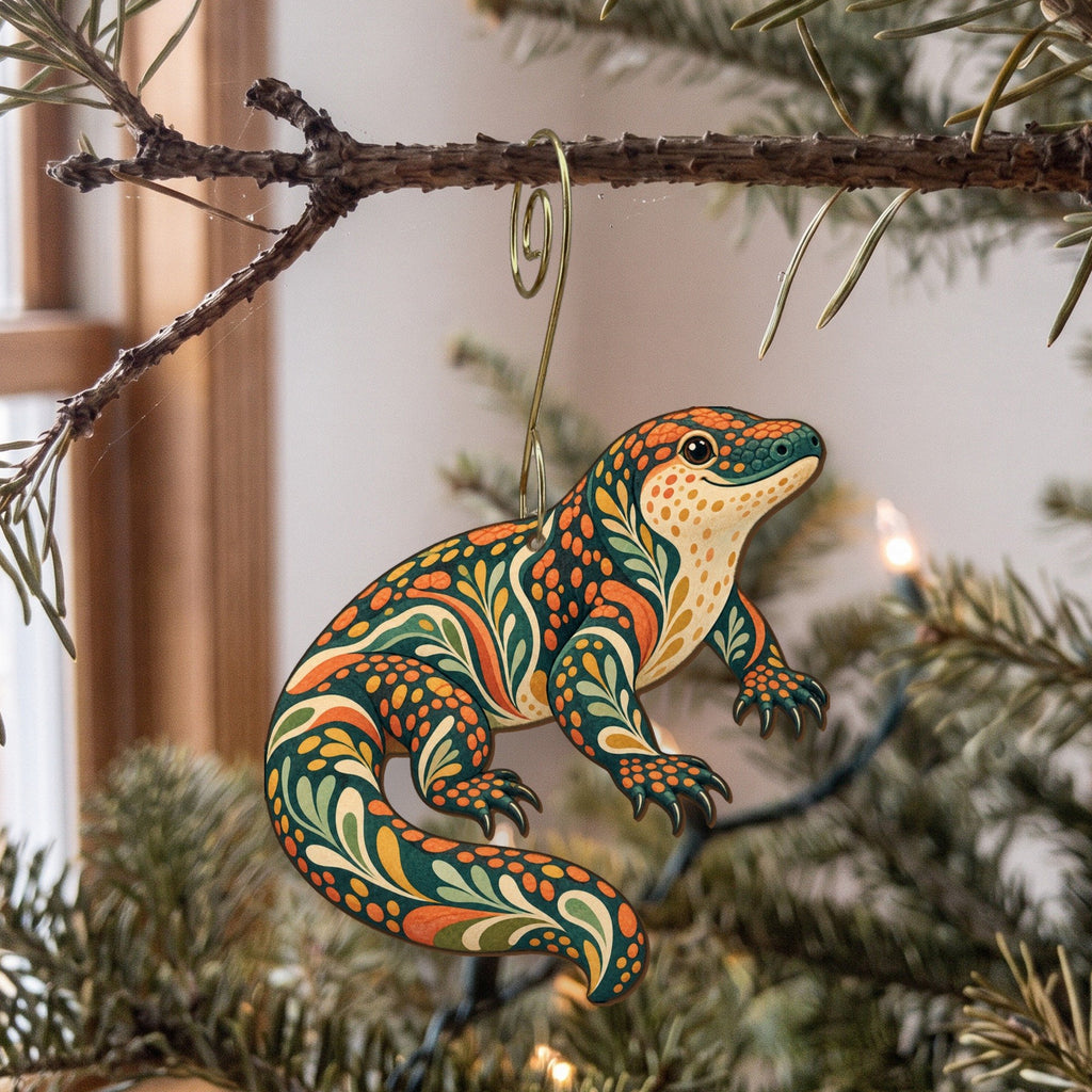 Laser-cut maple wood Gila Monster folk art ornament O331 hanging on a fir branch, made in USA