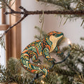 Laser-cut maple wood Gila Monster folk art ornament O331 hanging on a fir branch, made in USA