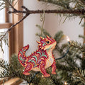 Laser-cut maple wood Horned Lizard folk art ornament O334 hanging on a fir branch, made in USA