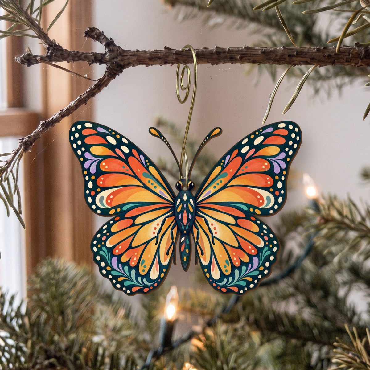 Laser-cut maple wood Monarch Butterfly folk art ornament O335 hanging on a fir branch, made in USA