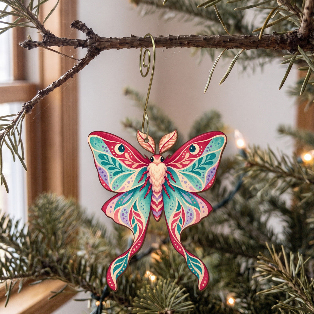 Laser-cut maple wood Luna Moth folk art ornament O336 hanging on a fir branch, made in USA