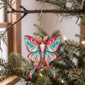 Laser-cut maple wood Luna Moth folk art ornament O336 hanging on a fir branch, made in USA