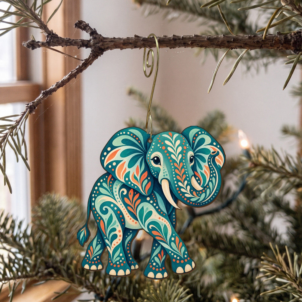 Laser-cut maple wood African Elephant folk art ornament O337 hanging on a fir branch, made in USA