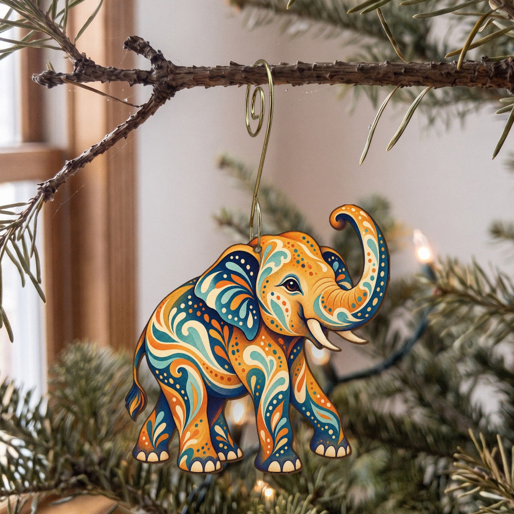 Laser-cut maple wood Asian Elephant folk art ornament O338 hanging on a fir branch, made in USA