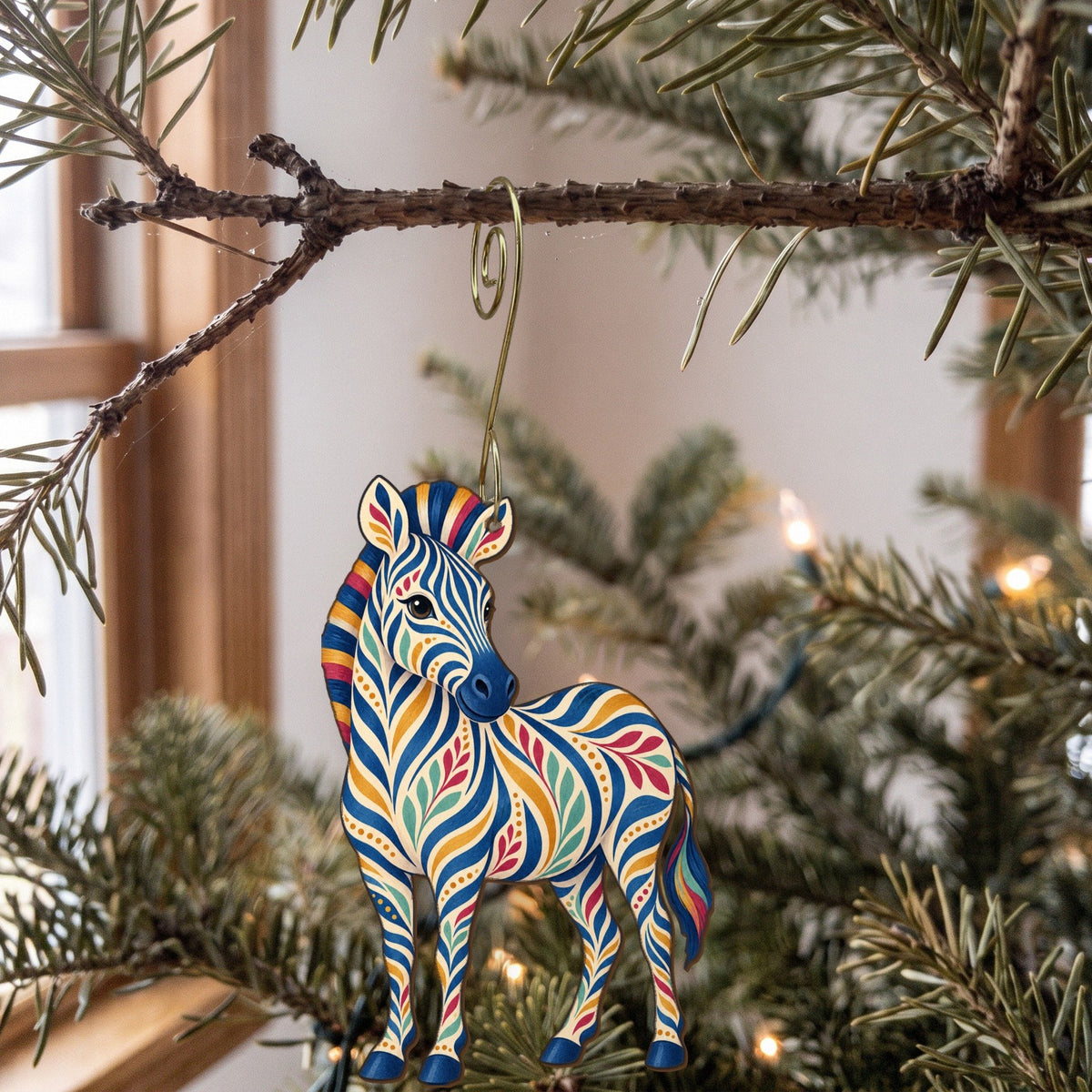 Laser-cut maple wood Plains Zebra folk art ornament O341 hanging on a fir branch, made in USA