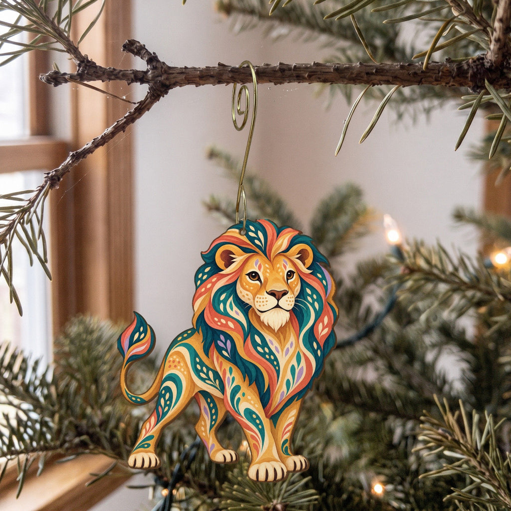 Laser-cut maple wood African Lion folk art ornament O343 hanging on a fir branch, made in USA