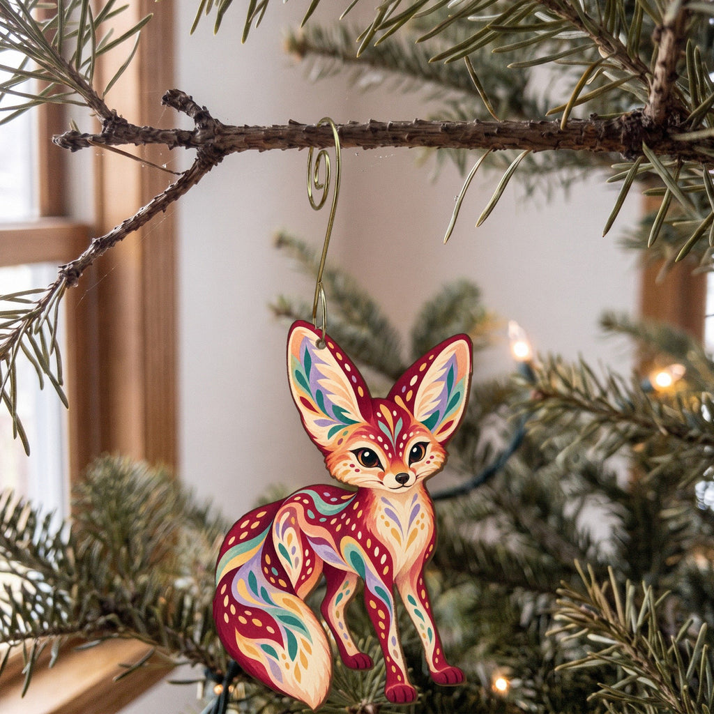 Laser-cut maple wood Fennec Fox folk art ornament O358 hanging on a fir branch, made in USA