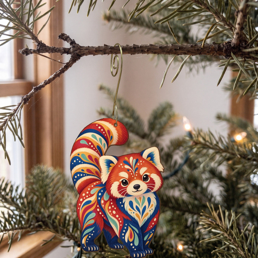 Laser-cut maple wood Red Panda folk art ornament O365 hanging on a fir branch, made in USA