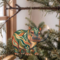 Laser-cut maple wood Pygmy Hippopotamus folk art ornament O371 hanging on a fir branch, made in USA