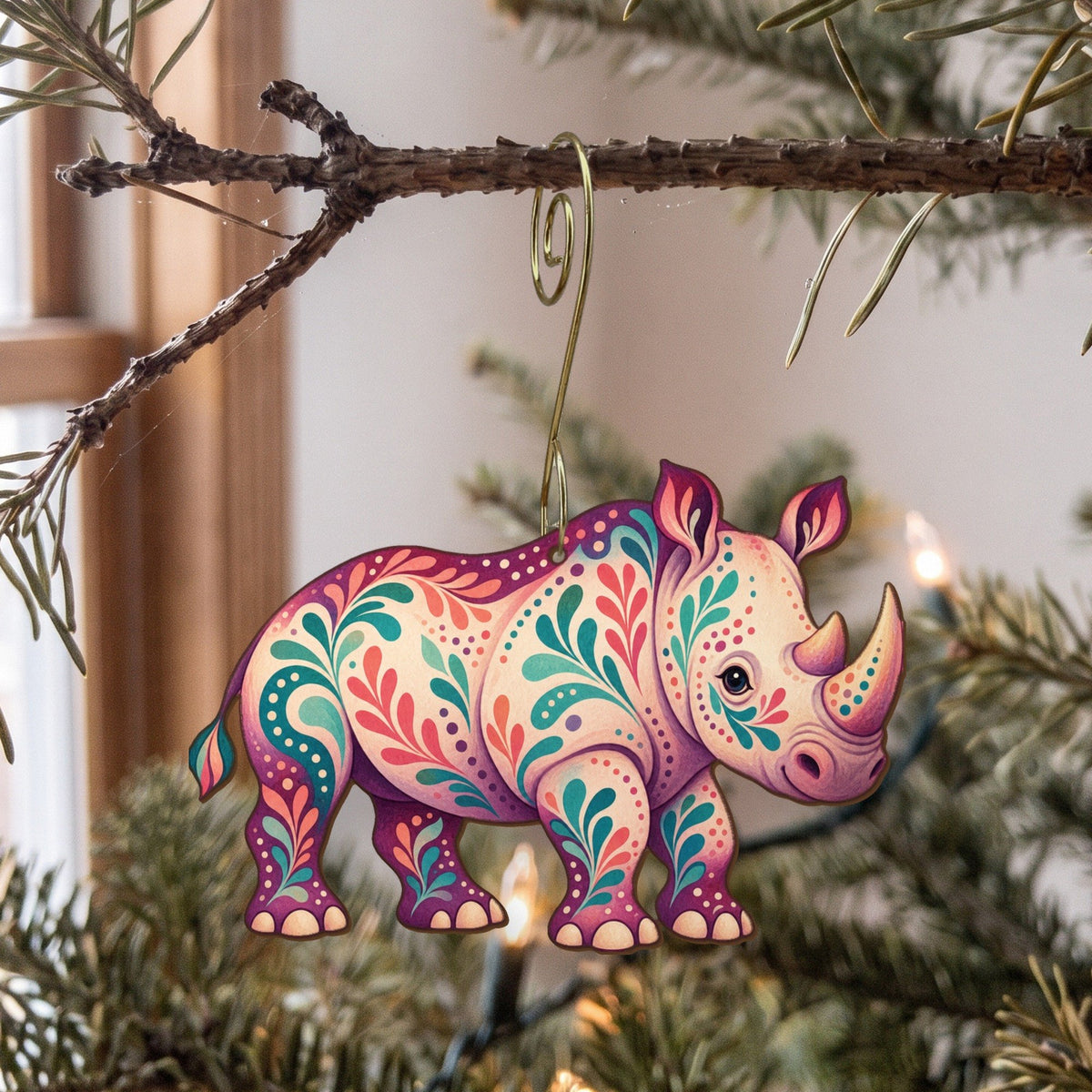 Laser-cut maple wood White Rhinoceros folk art ornament O372 hanging on a fir branch, made in USA