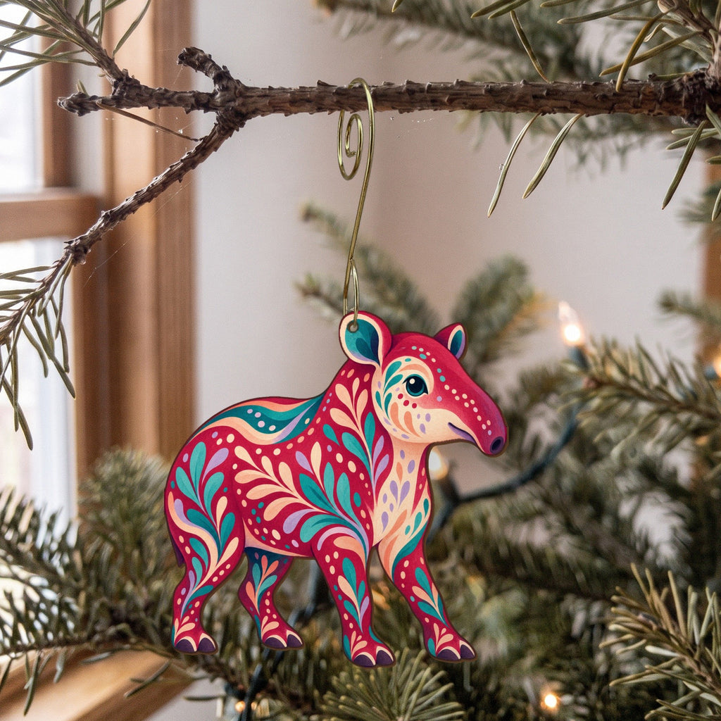 Laser-cut maple wood Brazilian Tapir folk art ornament O376 hanging on a fir branch, made in USA