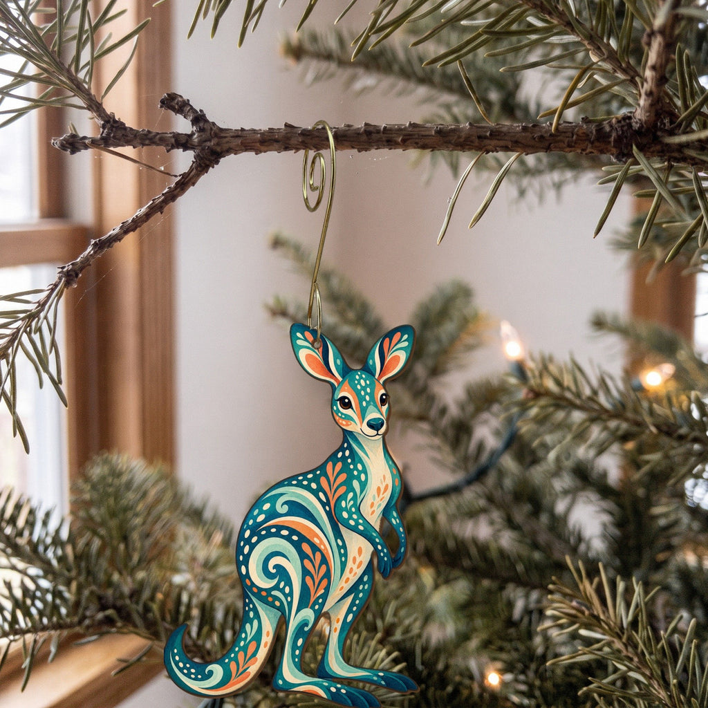 Laser-cut maple wood Kangaroo folk art ornament O393 hanging on a fir branch, made in USA