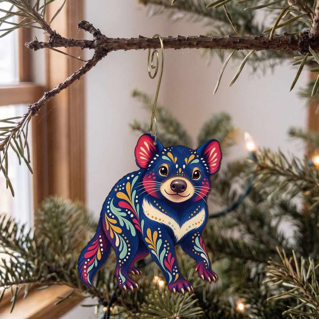 Laser-cut maple wood Tasmanian Devil folk art ornament O397 hanging on a fir branch, made in USA