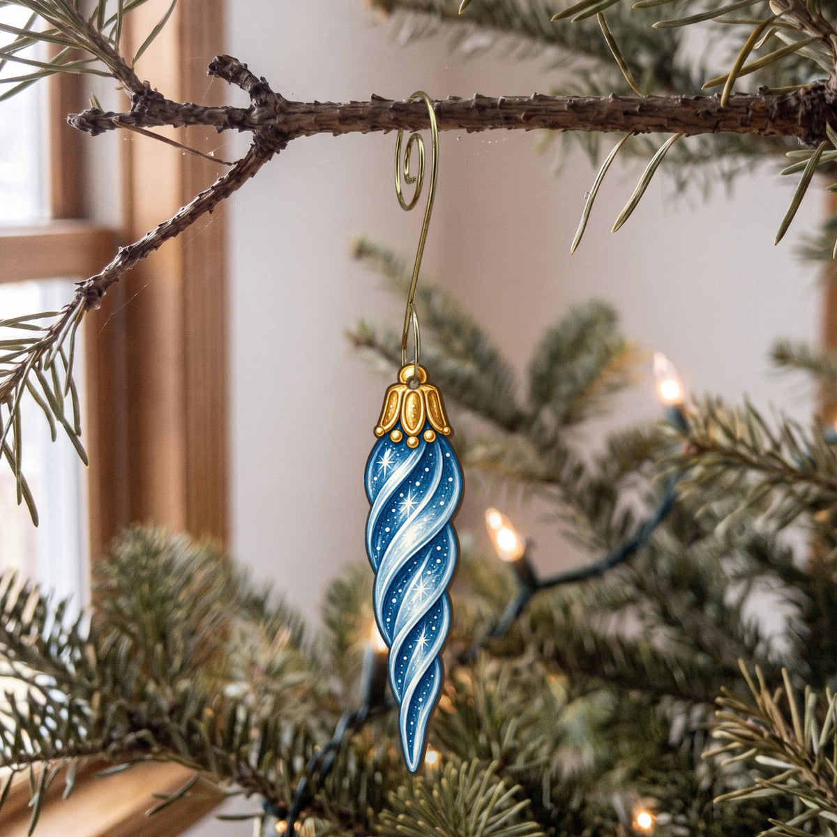 Laser-cut maple wood Christmas ornament O39 hanging on a fir branch, made in USA