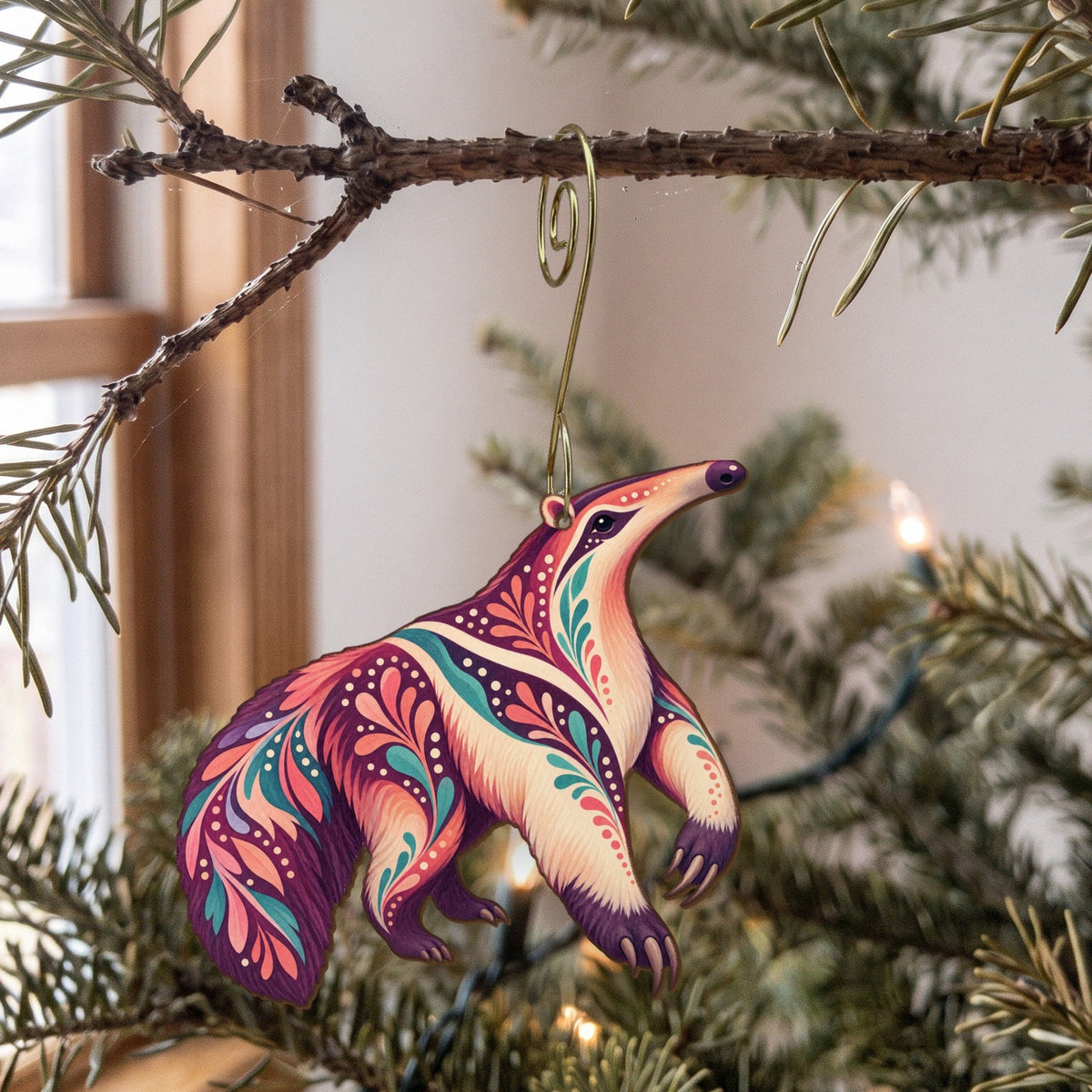 Laser-cut maple wood Giant Anteater folk art ornament O404 hanging on a fir branch, made in USA
