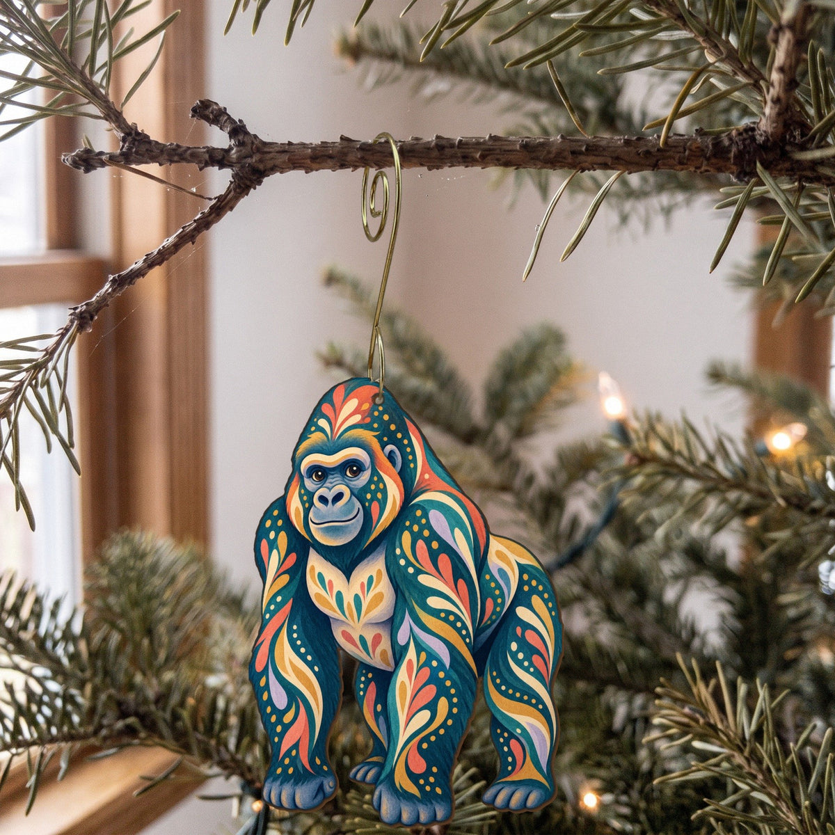Laser-cut maple wood Western Lowland Gorilla folk art ornament O415 hanging on a fir branch, made in USA