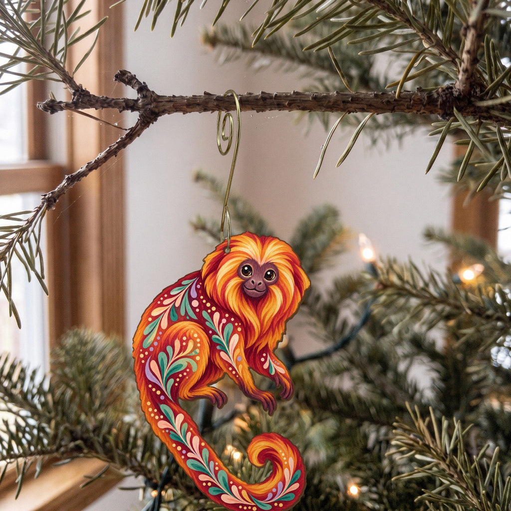 Laser-cut maple wood Golden Lion Tamarin folk art ornament O422 hanging on a fir branch, made in USA