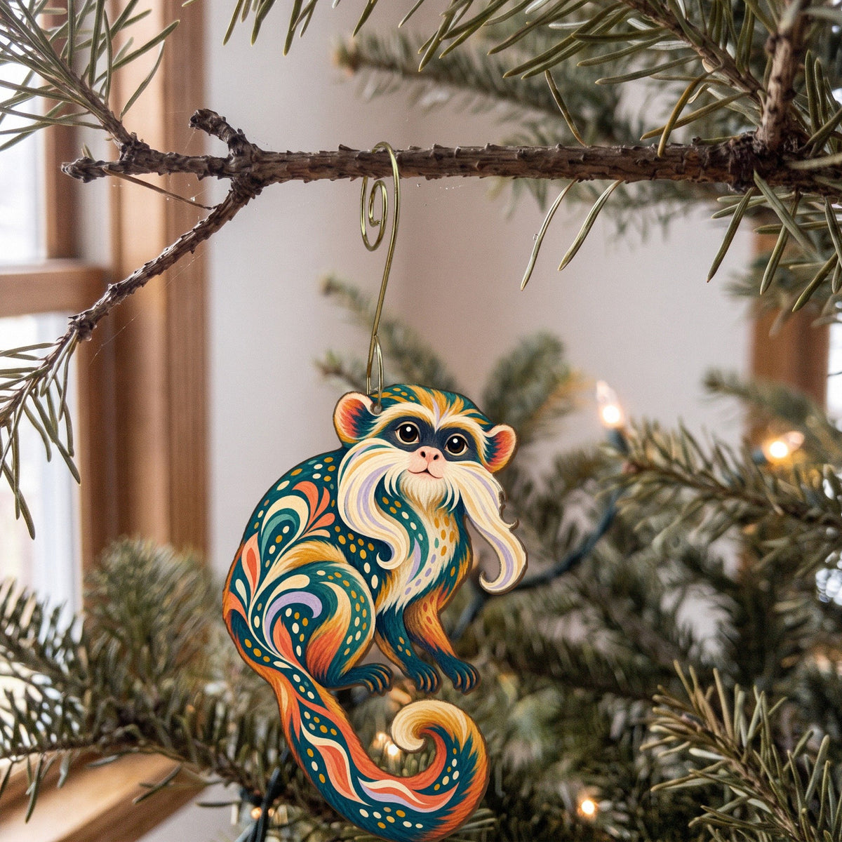 Laser-cut maple wood Emperor Tamarin folk art ornament O423 hanging on a fir branch, made in USA