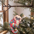 Laser-cut maple wood Cotton-Top Tamarin folk art ornament O424 hanging on a fir branch, made in USA