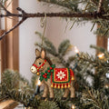 Laser-cut maple wood Christmas ornament O42 hanging on a fir branch, made in USA