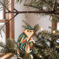 Laser-cut maple wood Douc Langur folk art ornament O435 hanging on a fir branch, made in USA