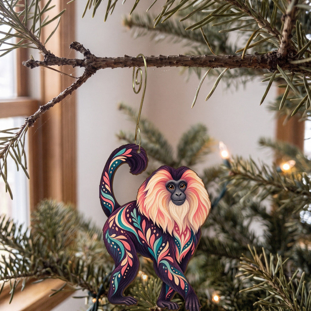 Laser-cut maple wood Lion-Tailed Macaque folk art ornament O436 hanging on a fir branch, made in USA
