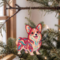 Laser-cut maple wood Corgi folk art ornament O440 hanging on a fir branch, made in USA