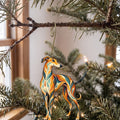 Laser-cut maple wood Greyhound folk art ornament O450 hanging on a fir branch, made in USA