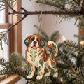 Laser-cut maple wood Saint Bernard folk art ornament O451 hanging on a fir branch, made in USA