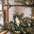 Laser-cut maple wood Tuxedo Cat folk art ornament O459 hanging on a fir branch, made in USA