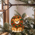 Laser-cut maple wood Christmas ornament O45 hanging on a fir branch, made in USA