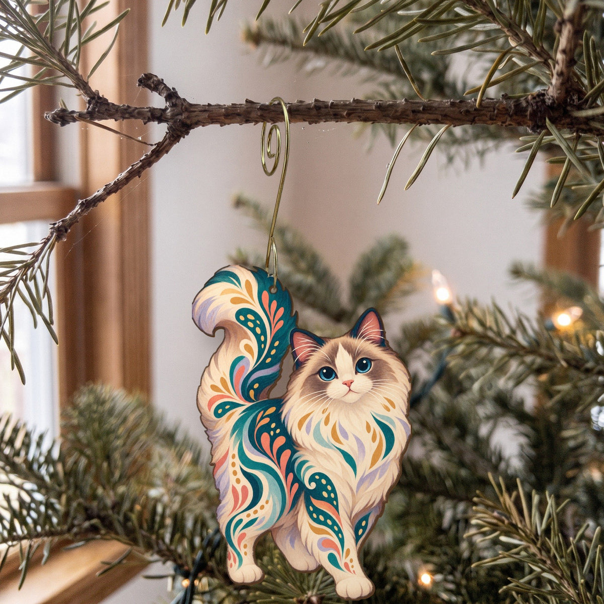 Laser-cut maple wood Ragdoll Cat folk art ornament O463 hanging on a fir branch, made in USA