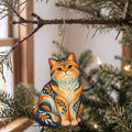 Laser-cut maple wood British Shorthair Cat folk art ornament O466 hanging on a fir branch, made in USA