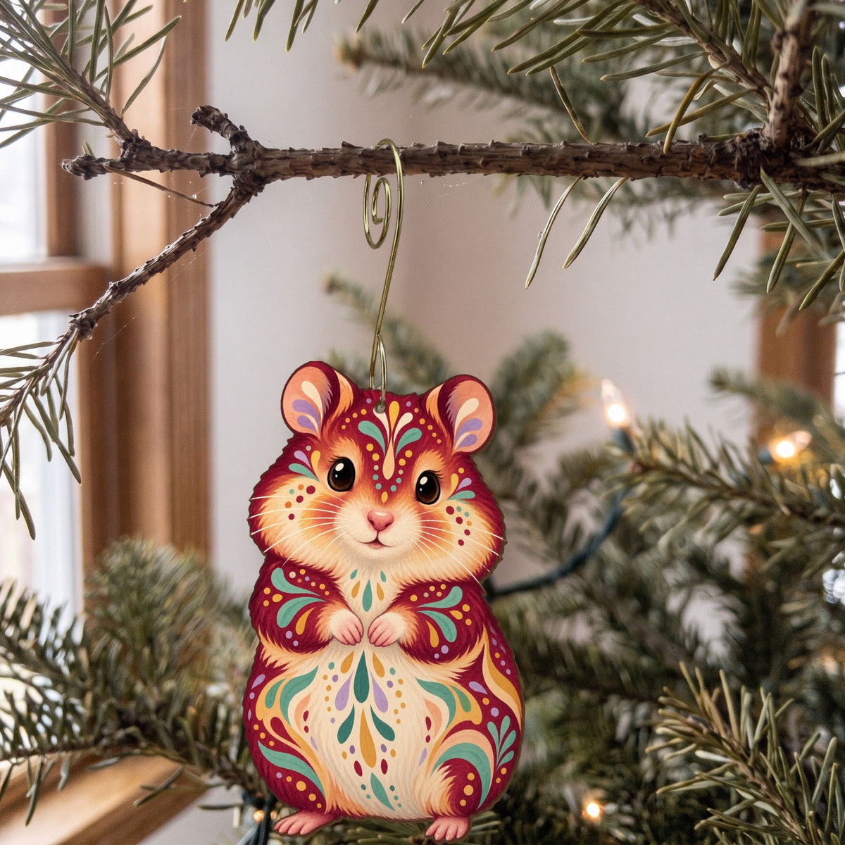 Laser-cut maple wood Syrian Hamster folk art ornament O470 hanging on a fir branch, made in USA