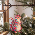 Laser-cut maple wood Gerbil folk art ornament O472 hanging on a fir branch, made in USA