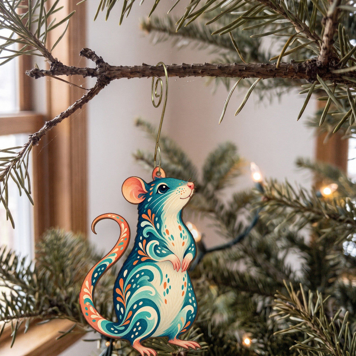 Laser-cut maple wood Fancy Rat folk art ornament O473 hanging on a fir branch, made in USA