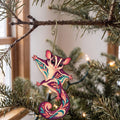 Laser-cut maple wood Sugar Glider folk art ornament O476 hanging on a fir branch, made in USA